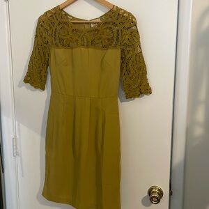 Olive green cocktail dress. Perfect for wedding guest! Lace overlay on arms.